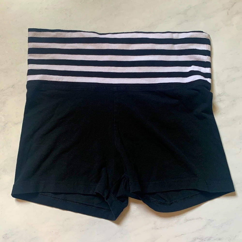 Size small black athletic shorts with black and white striped waist band